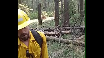 Lumberjack wanking outdoors.